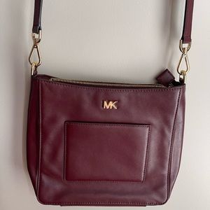 Michael Kors oxblood colour smooth leather crossbody.